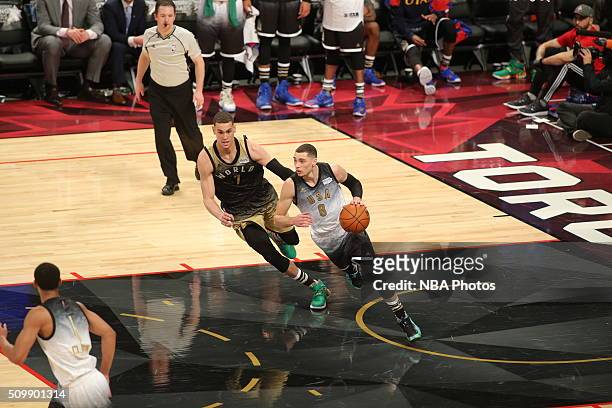 Zach LaVine of the USA Team dribbles the ball against Dwight Powell of the World Team during the BBVA Compass Rising Stars Challenge as part of 2016...