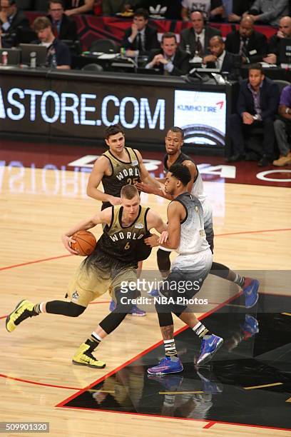 Kristaps Porzingis of the World Team drives to the basket against D'Angelo Russell of the USA Team during the BBVA Compass Rising Stars Challenge as...