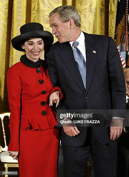 President George W. Bush stands with performer Rita Moreno before he presented her with the Presidential Medal of Freedom, the Nation's highest civil...