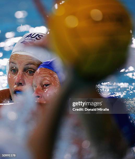 Jodie Stuhmcke of Australia and Valerie Dionne of Canada look for the ball to be dropped in the hole during the 2004 FINA Women's Water Polo League...