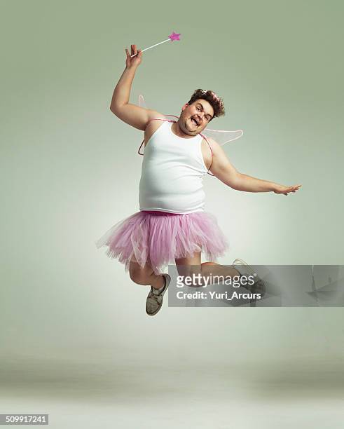 showing his lighter side! - roze jurk stockfoto's en -beelden