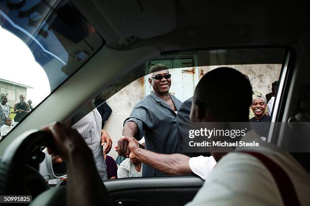 Kim Collins, 100m sprinter of St Kitts and Nevis and Olympic contender for Athens at home meets up with friends on April 21, 2004 in Frigate Bay,...