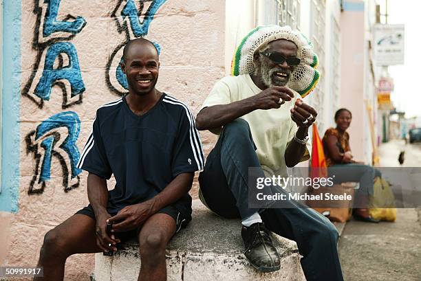 Kim Collins, 100m sprinter of St Kitts and Nevis and Olympic contender for Athens at home meets up with friends on April 21, 2004 in Frigate Bay,...