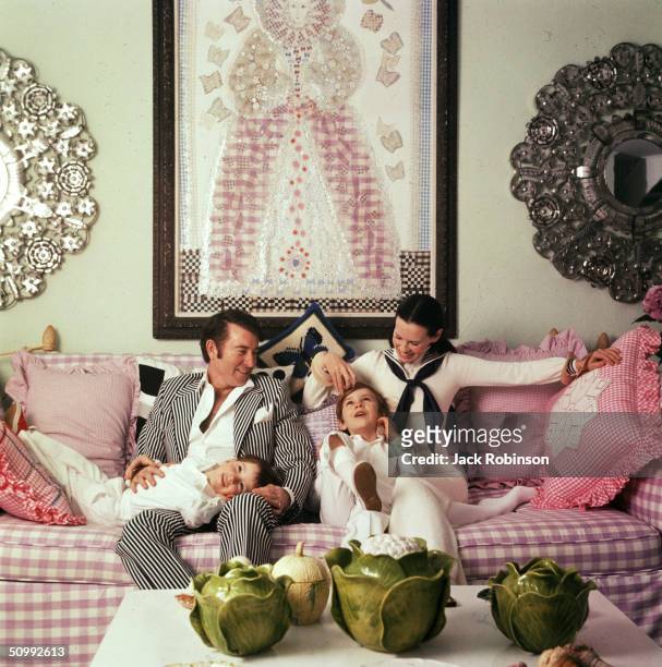 Family portrait of the Coopers as they play on a sofa in their home, Southampton, Long Island, New York, March 30, 1972. American author and actor...