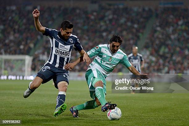 Ricardo Osorio of Monterrey and Martin Bravo of Santos Laguna fight for the ball during a 6TH round match between Santos Laguna and Monterrey as part...