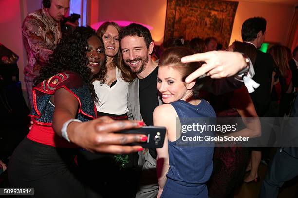 Thelma Buabeng, Katrin Berben, Oliver Berben and Josefine Preuss make a selfie during the Bunte and BMW Festival Night 2016 during the 66th Berlinale...