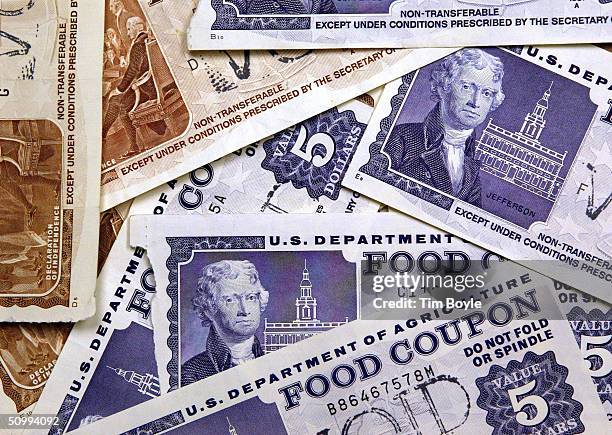 Older, traditional food stamps are displayed June 24, 2004 at an Illinois Department of Human Services office in Skokie, Illinois. Agriculture...