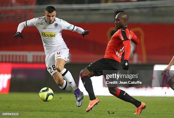 Romain Saiss of Angers and Giovanni Sio of Rennes in action during the French Ligue 1 match between Stade Rennais FC and SCO Angers at Roazhon Park...