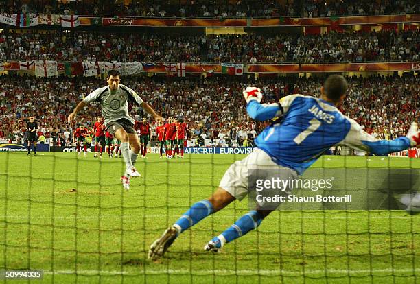 Goalkeeper Ricardo of Portugal scores their winning penalty during the UEFA Euro 2004 Quarter Final match between Portugal and England at the Luz...
