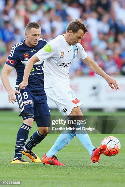 Alexander Wilkinson of the City kicks the ball away from Besart Berisha of the Victory during the round 19 A-League match between Melbourne City FC...