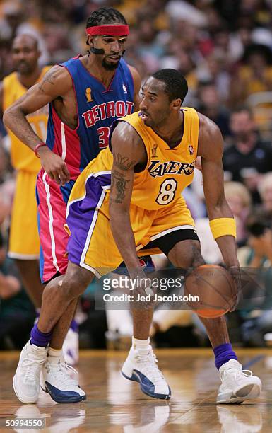Kobe Bryant of the Los Angeles Lakers is defended by Richard Hamilton of the Detroit Pistons in Game two of the 2004 NBA Finals at Staples Center on...