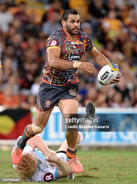 Greg Inglis of the Indigenous All Stars breaks through the defence during the NRL match between the Indigenous All-Stars and the World All-Stars at...