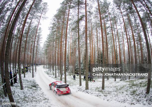 Craig Breen of Ireland and his co-driver Scott Martin of Britain steer their Citroen DS3 WRC during the 10th stage of the Rally Sweden, second round...