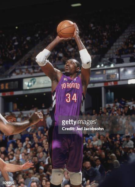 Center Hakeem Olajuwon of the Toronto Raptors shoots the ball against the Sacramento Kings during the NBA game at Arco Arena in Sacramento,...