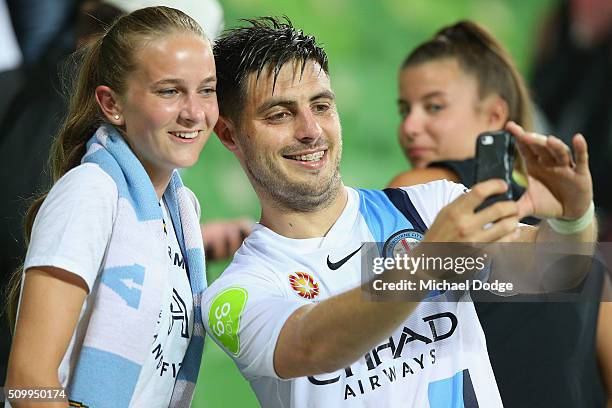 Bruno Fornaroli of the City poses with a fan after the round 19 A-League match between Melbourne City FC and Melbourne Victory at AAMI Park on...