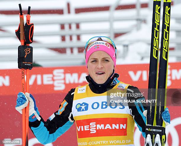 Norway's Therese Johaug celebrates winning the women's 5 km competition at the FIS Cross-Country World Cup in Falun, Sweden, February 13, 2016. / AFP...