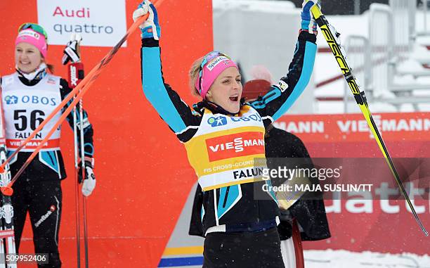 Norway's Therese Johaug celebrates winning the women's 5 km competition at the FIS Cross-Country World Cup in Falun, Sweden, February 13, 2016. / AFP...