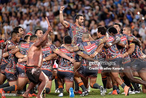 Greg Inglis of the Indigenous All Stars and team mates perform a cultural dance before the NRL match between the Indigenous All-Stars and the World...