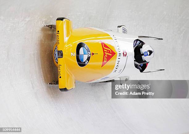 Beat Hefti and Alex Baumann of Switzerland complete their first run in the Men's 2-man Bobsleigh during Day 2 of the IBSF World Championships for Bob...