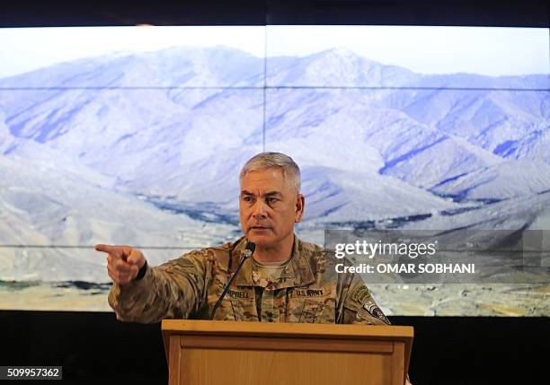 Commander of international and US forces in Afghanistan, US Army General John Campbell, speaks during a news conference at the Resolute Support...