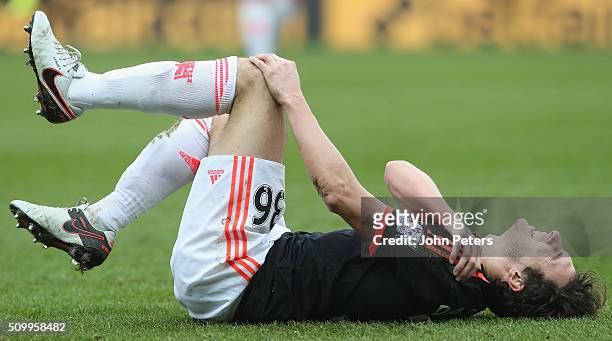 Matteo Darmian of Manchester United lies injured during the Barclays Premier League match between Sunderland and Manchester United at Stadium of...