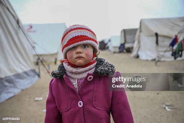 Syrian kid, who fled bombing in Aleppo, is seen at a tent city close to the Bab al-Salam border crossing on Turkish-Syrian border near Azaz town of...