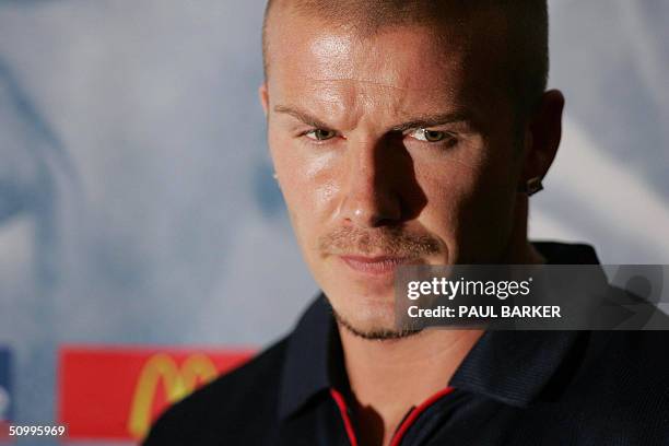 England's midfielder and captain David Beckham listens to journalists' questions 25 June 2004 during a press conference in Lisbon. England's dreams...