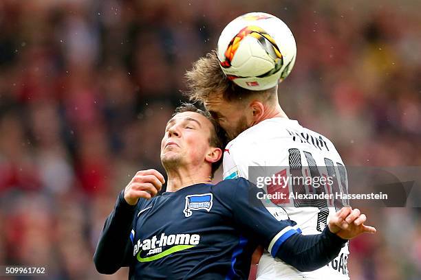 Alexandru Maxim of Stuttgart battles for the ball with Vladimir Darida of Hertha during the Bundesliga match between VfB Stuttgart and Hertha BSC...