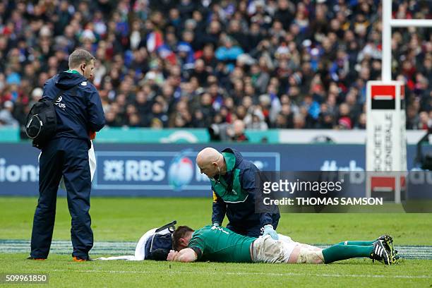 Ireland's flanker Sean O'Brien lies on the pitch during the Six Nations international rugby union match between France and Ireland at the Stade de...