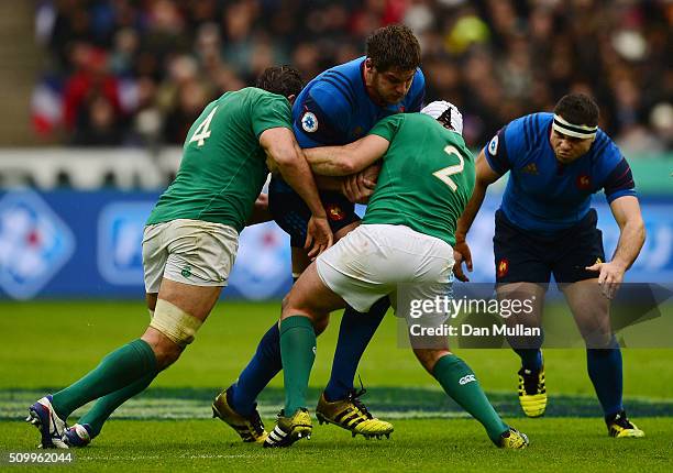 Alexandre Flanquart of France is tackled by Mike McCarthy and Rory Best of Ireland during the RBS Six Nations match between France and Ireland at the...