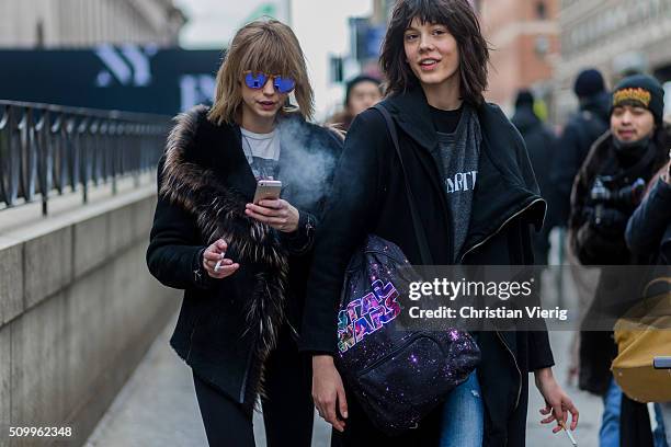 Fashion models Ewa Wladymiruk from Poland wearing a black Star Wars backpack a black coat and a grey shirt seen outside BCBG Max Azria during New...