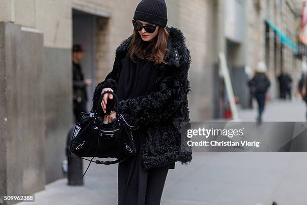 Fashion model wearing a black fluffy fur jacket seen outside Creatures of the Wind during New York Fashion Week: Women's Fall/Winter 2016 on February...