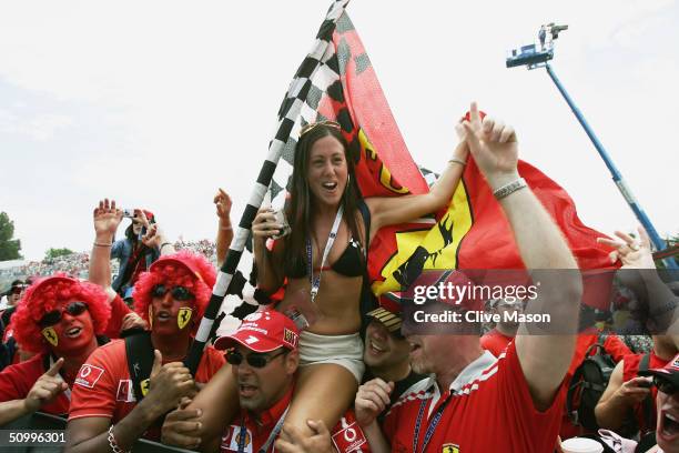 Ferrari Tifosi invade the track after the Canadian Formula One Grand Prix held on June 13 at the Circuit Gilles Villeneuve, in Montreal, Canada.