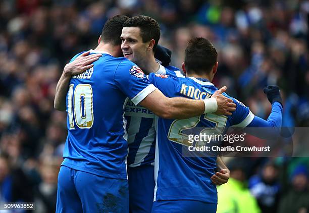Jamie Murphy of Brighton celebrates with team mates Anthony Knockhaert and Tomer Hemed after scoring the first goal of the game during the Sky Bet...