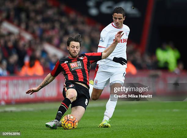 Harry Arter of Bournemouth and Ibrahim Afellay of Stoke City compete for the ball during the Barclays Premier League match between A.F.C. Bournemouth...