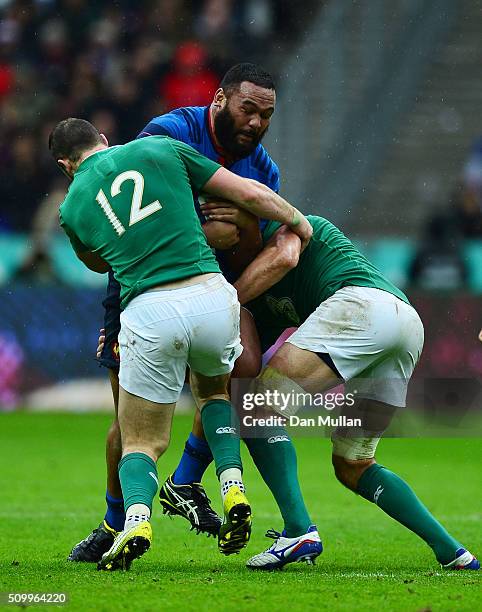 Uini Atonio of France is tackled by Robbie Henshaw and Mike McCarthy of Ireland during the RBS Six Nations match between France and Ireland at the...