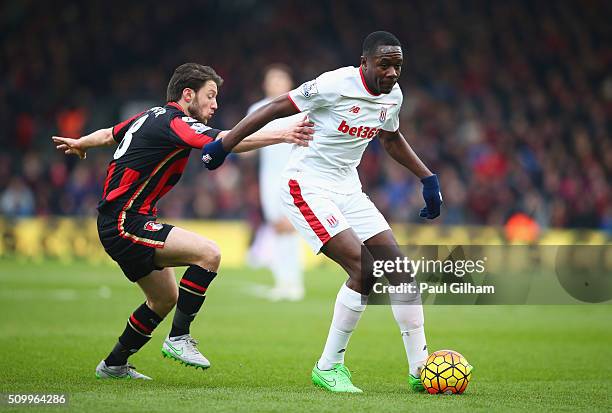 Giannelli Imbula of Stoke City controls the ball under pressure of Harry Arter of Bournemouth during the Barclays Premier League match between A.F.C....