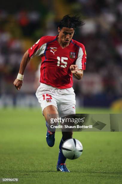 Milan Baros of Czech Republic runs with the ball during the UEFA Euro 2004 Group D match between Germany and Czech Republic at the Estadio de Jose...