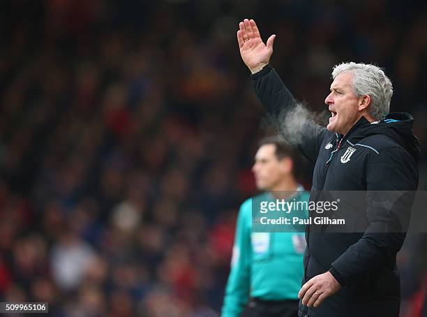 Mark Hughes manager of Stoke City gestures during the Barclays Premier League match between A.F.C. Bournemouth and Stoke City at Vitality Stadium on...