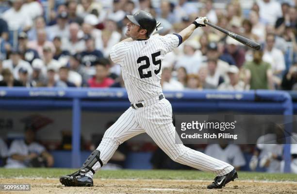 Infielder Jason Giambi of the New York Yankees swings at a Colorado Rockies pitch during the interleague game at Yankee Stadium on June 10, 2004 in...