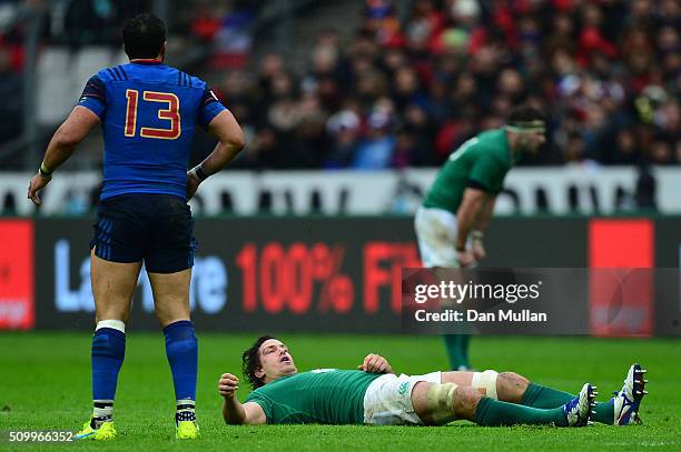 Mike McCarthy of Ireland lies injured during the RBS Six Nations match between France and Ireland at the Stade de France on February 13, 2016 in...