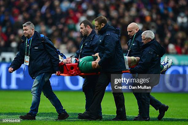 The injured Mike McCarthy of Ireland is stretechered off the pitch during the RBS Six Nations match between France and Ireland at the Stade de France...