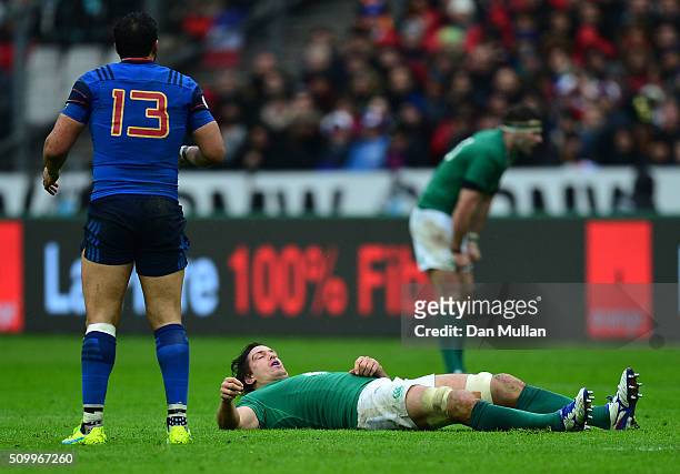 Mike McCarthy of Ireland lies injured during the RBS Six Nations match between France and Ireland at the Stade de France on February 13, 2016 in...