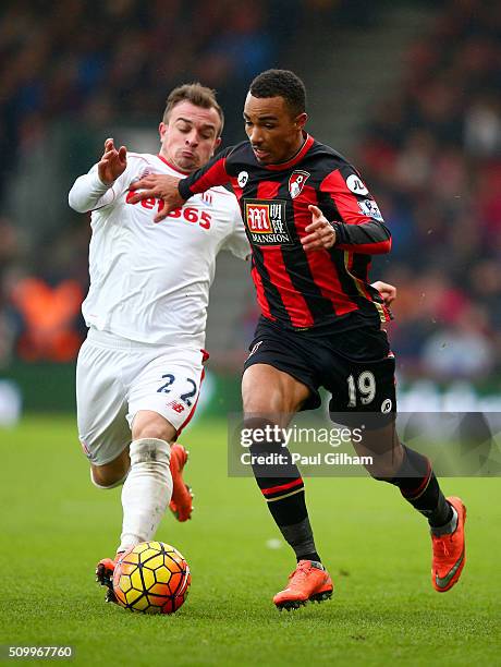 Junior Stanislas of Bournemouth and Xherdan Shaqiri of Stoke City compete for the ball during the Barclays Premier League match between A.F.C....