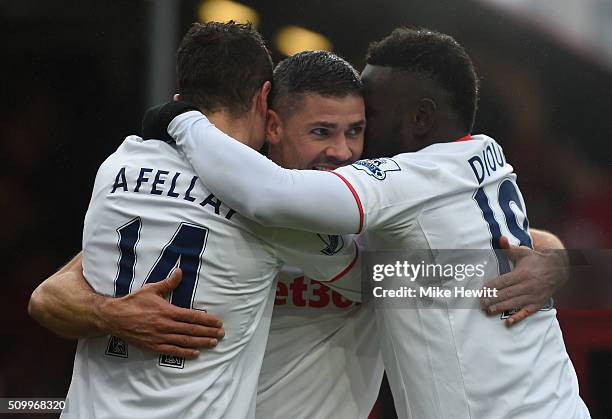 Ibrahim Afellay of Stoke City celebrates scoring his team's second goal with his team mates Jonathan Walters and Mame Biram Diouf during the Barclays...