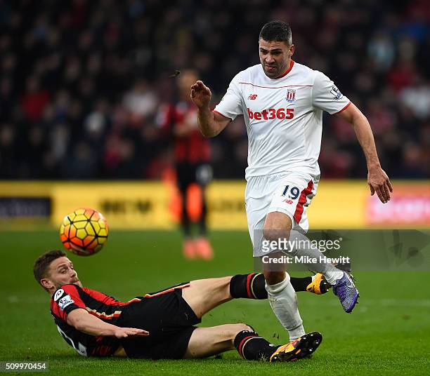 Jonathan Walters of Stoke City is challenged by Simon Francis of Bournemouth during the Barclays Premier League match between A.F.C. Bournemouth and...
