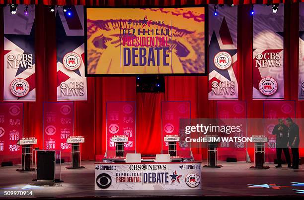Workers prepare the stage for the CBS News Republican Presidential Debate in Greenville, South Carolina, on February 13, 2016. / AFP / JIM WATSON