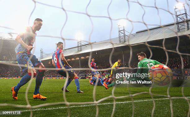 Troy Deeney of Watford scores his team's second goal past Wayne Hennessey of Crystal Palace during the Barclays Premier League match between Crystal...