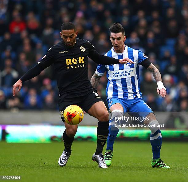 Liam Feeney of Bolton holds the ball up from Brighton's Liam Ridgewell during the Sky Bet Championship match between Brighton and Hove Albion and...