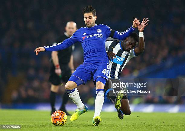 Cesc Fabregas of Chelsea is tacked by Cheik Ismael Tiote of Newcastle United during the Barclays Premier League match between Chelsea and Newcastle...